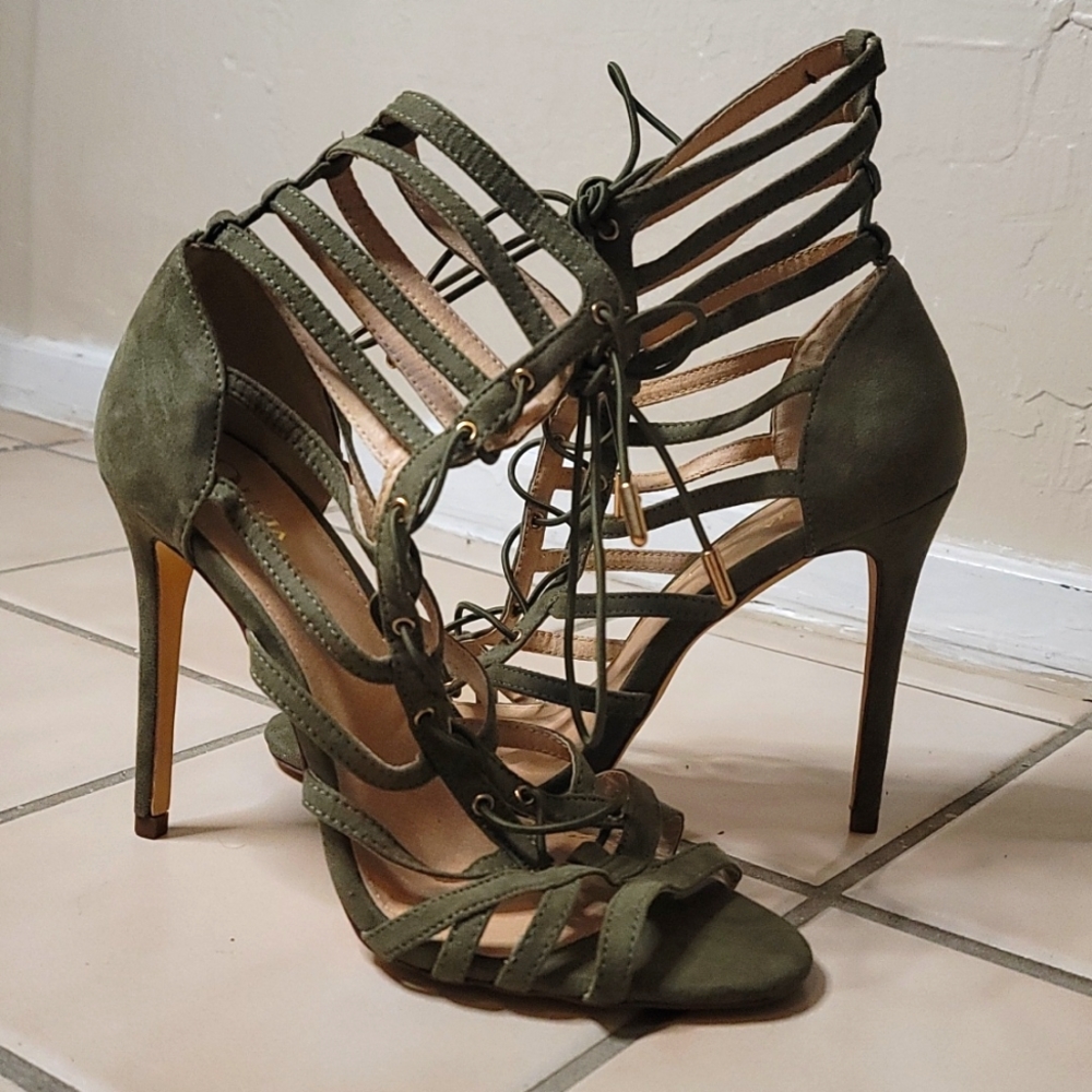 Green laced up opened-toed heels by Olivia Jaymes